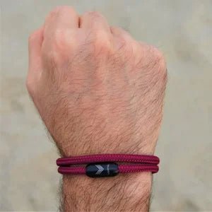 Vertig Magnetic Nautical Paracord Bracelet Burgundy on a man's wrist. Adds a sophisticated, rugged touch.