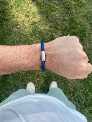 Vertig Magnetic Nautical Paracord Bracelet Navy Blue (Slim) on a man's wrist. Adds a sophisticated, maritime statement.