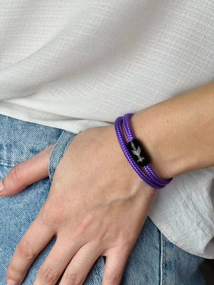 Vertig Magnetic Nautical Paracord Bracelet Purple on a woman's arm. Comfortable fit, highlighting its unique shade.