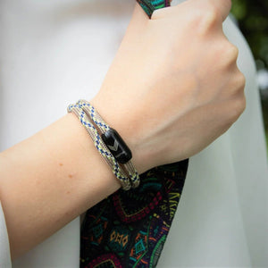 Close-up of Vertig Magnetic Nautical Paracord Bracelet Snake on a woman's wrist. Unique pattern, secure magnetic clasp.