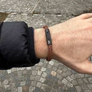 Vertig Magnetic Wide Leather Bracelet Brown on a man's wrist. Accentuates masculine style with its versatile brown leather band.