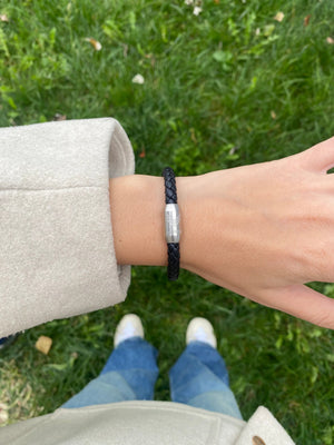 Vertig Magnetic Leather Bracelet Black (Slim) on a woman's wrist. Adds a sophisticated touch, highlighting its slender profile and genuine leather.