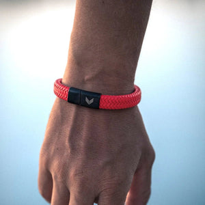 Vertig Magnetic Wide Leather Bracelet Orange on a man's wrist. Adds a striking, masculine accent to any look.