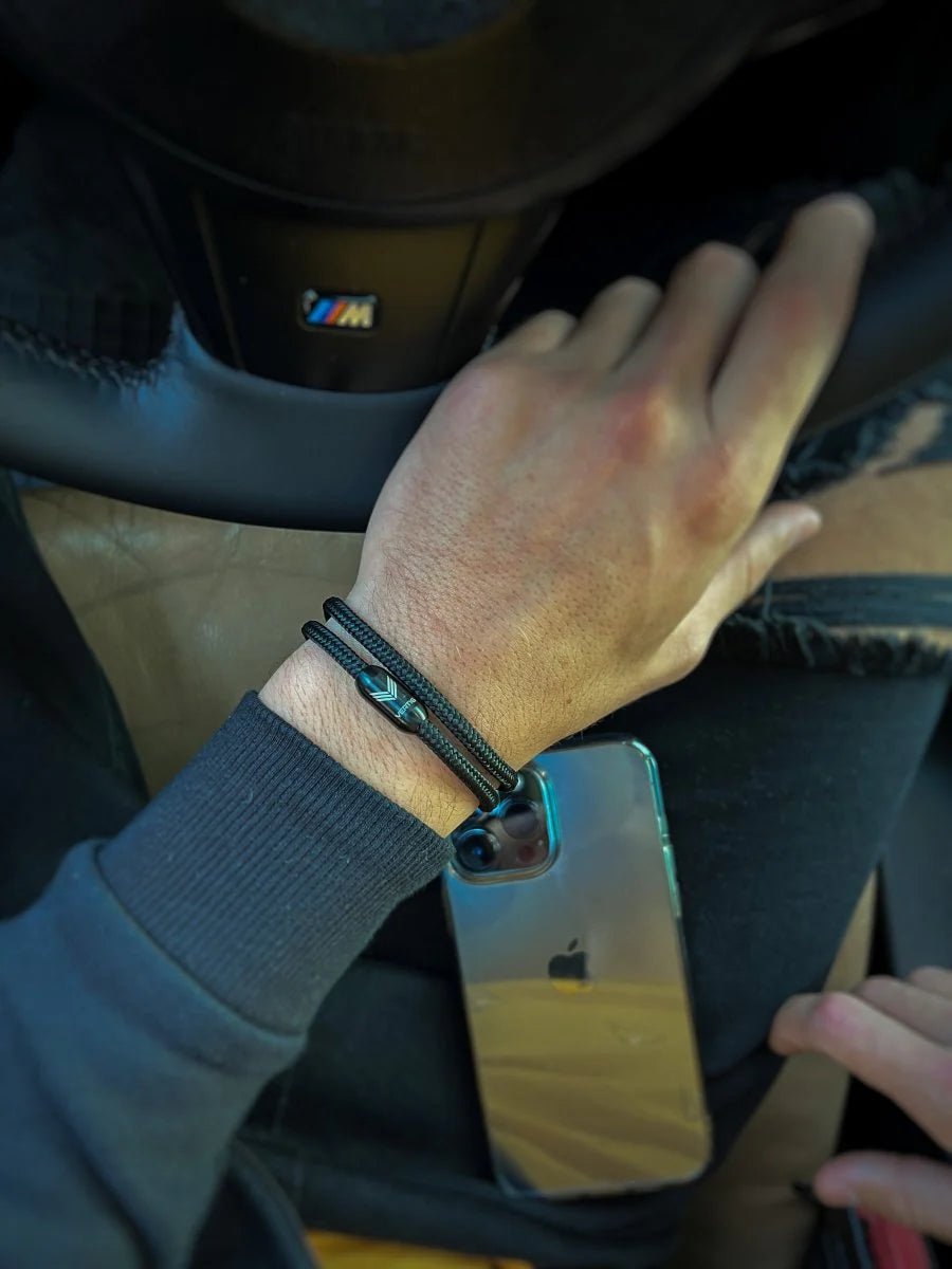 Vertig Magnetic Nautical Paracord Bracelet Black on a man&#39;s wrist. Lightweight, comfortable, and trendy.