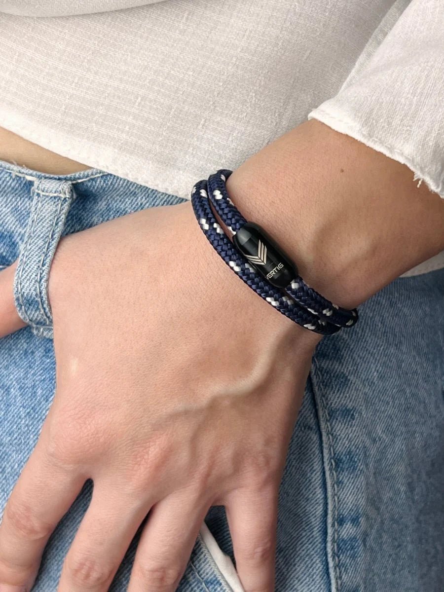 Vertig Magnetic Nautical Paracord Bracelet Blue-White on a woman&#39;s wrist. Stylish, durable accessory.