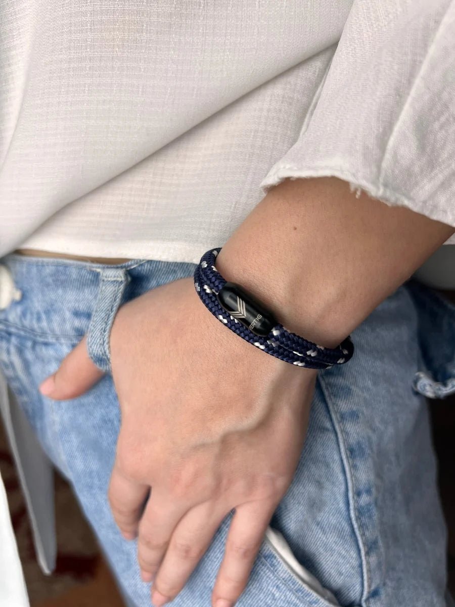 Vertig Magnetic Nautical Paracord Bracelet Blue-White on a woman&#39;s forearm. Features bright blue and white rope.