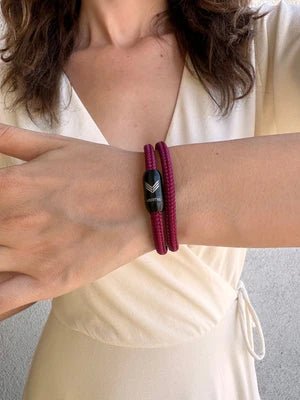 Vertig Magnetic Nautical Paracord Bracelet Burgundy on a woman. Versatile accessory for everyday fashion.