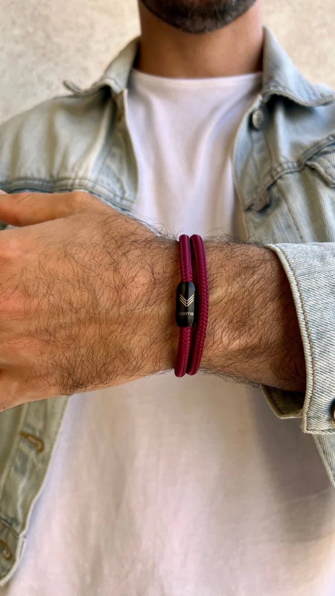 Vertig Magnetic Nautical Paracord Bracelet Burgundy on a man&#39;s forearm. Durable design, perfect for subtle style.