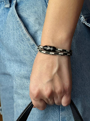 Vertig Magnetic Nautical Paracord Bracelet Camo on a woman's arm. Comfortable fit, highlighting its unique pattern.