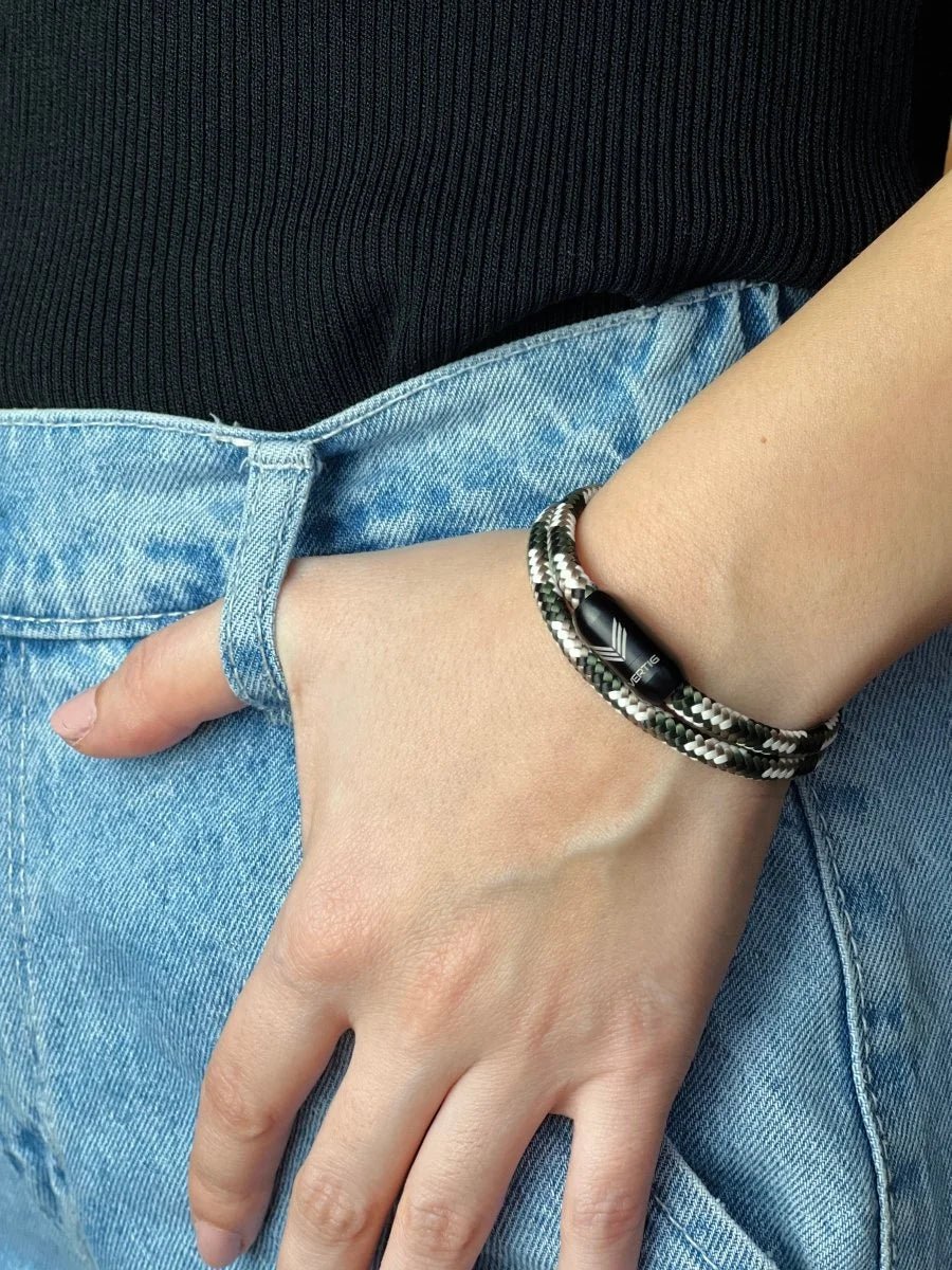 Vertig Magnetic Nautical Paracord Bracelet Camo on a woman&#39;s wrist. A stylish accessory for a casual, edgy look.