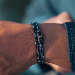 Vertig Magnetic Nautical Paracord Bracelet Dark Blue on a man. Perfect for casual wear, durable and water-resistant.