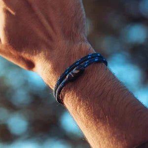 Vertig Magnetic Nautical Paracord Bracelet Dark Blue on a man&#39;s wrist. Lightweight, comfortable, and trendy.