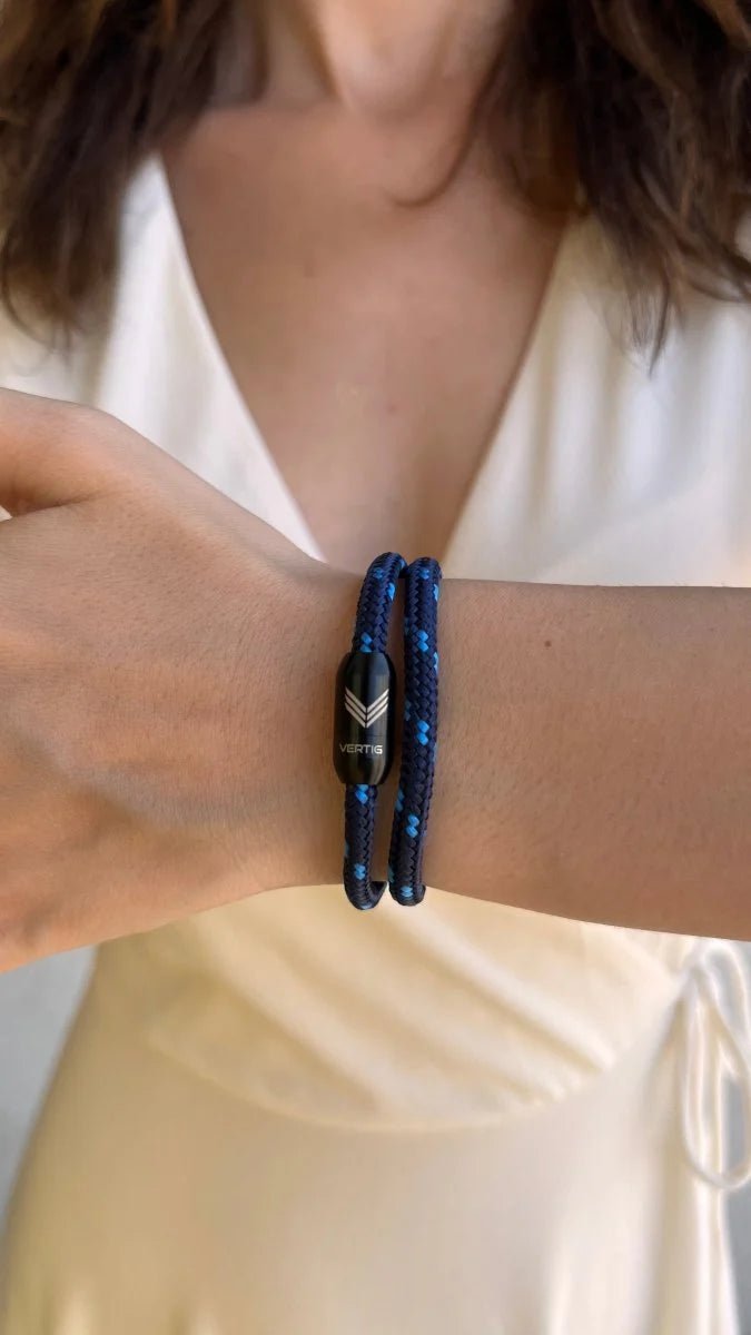 Vertig Magnetic Nautical Paracord Bracelet Dark Blue on a lady&#39;s wrist. Stylish, durable outdoor accessory.