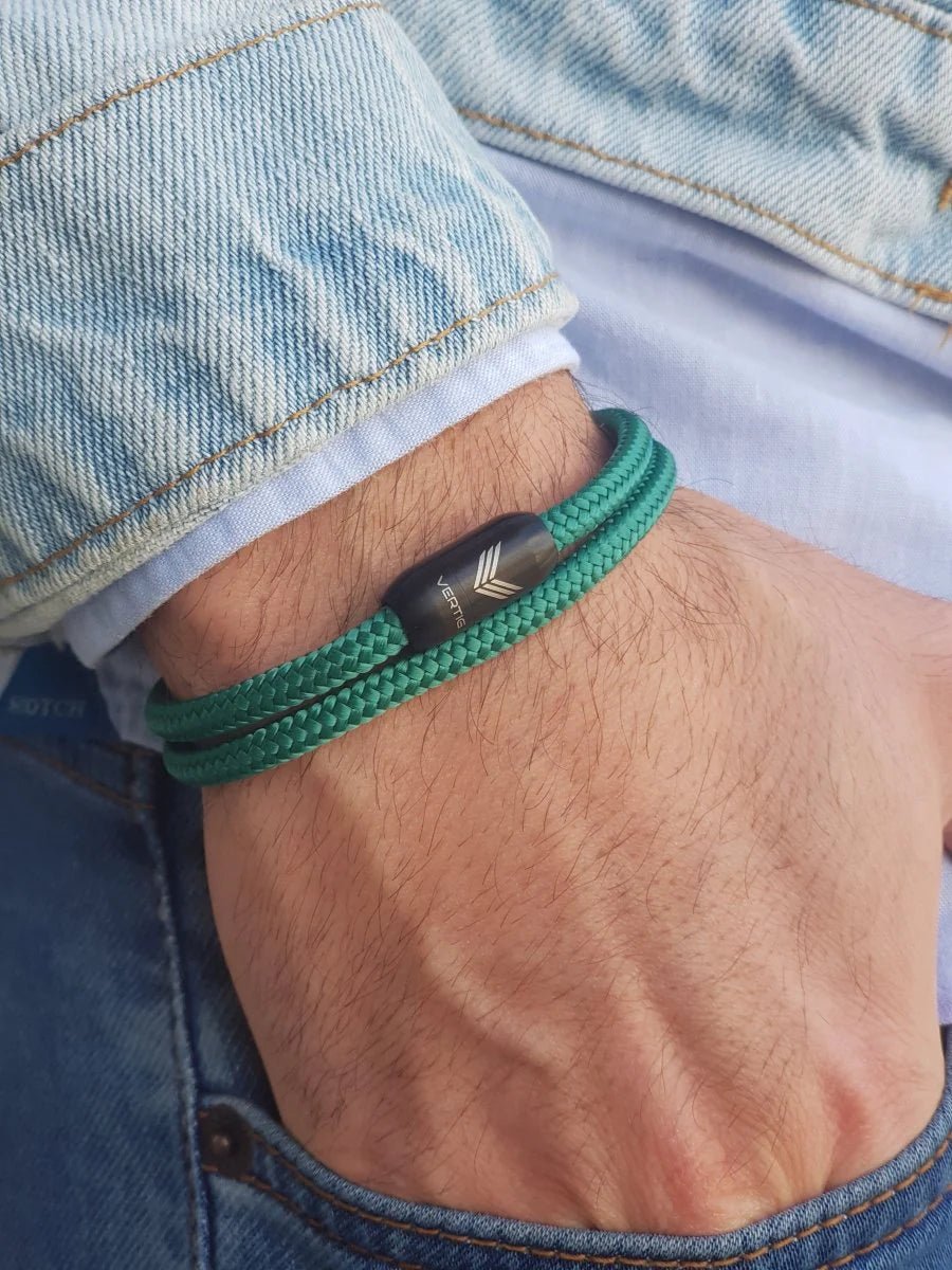 Vertig Magnetic Nautical Paracord Bracelet Green on a man&#39;s forearm. Durable design, perfect for outdoor enthusiasts.