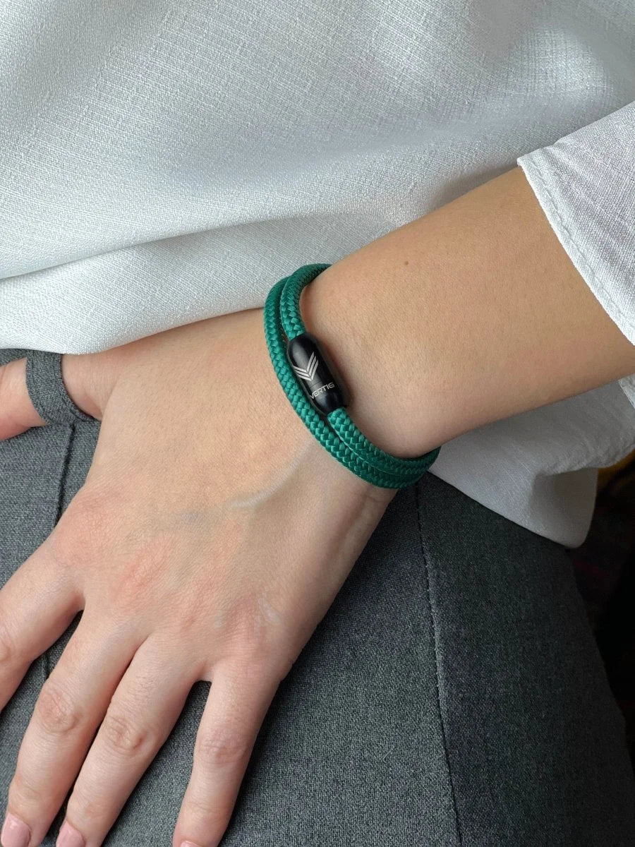 Vertig Magnetic Nautical Paracord Bracelet Green on a woman&#39;s wrist. A striking accessory for an organic look.