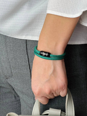 Vertig Magnetic Nautical Paracord Bracelet Green on a woman's arm. Comfortable fit, highlighting its unique shade.
