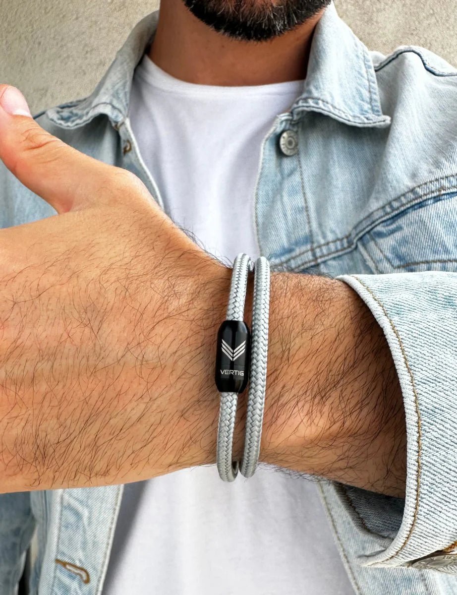 Vertig Magnetic Nautical Paracord Bracelet Grey on a man&#39;s wrist. Adds a subtle, modern statement.