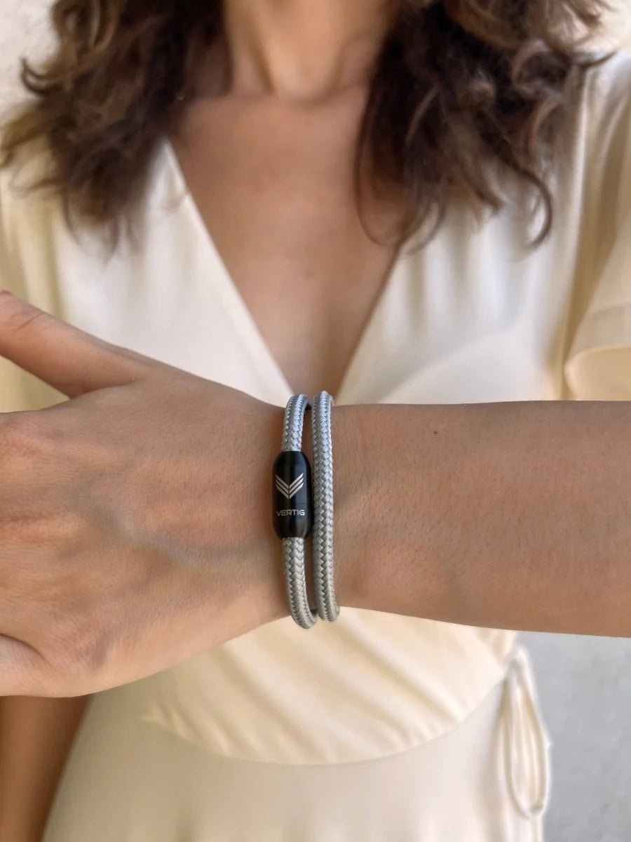  Vertig Magnetic Nautical Paracord Bracelet Grey on a woman&#39;s wrist. A chic accessory for everyday elegance.