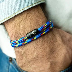 Vertig Magnetic Nautical Paracord Bracelet Multicolor on a man's forearm. Features bright multi-color rope.