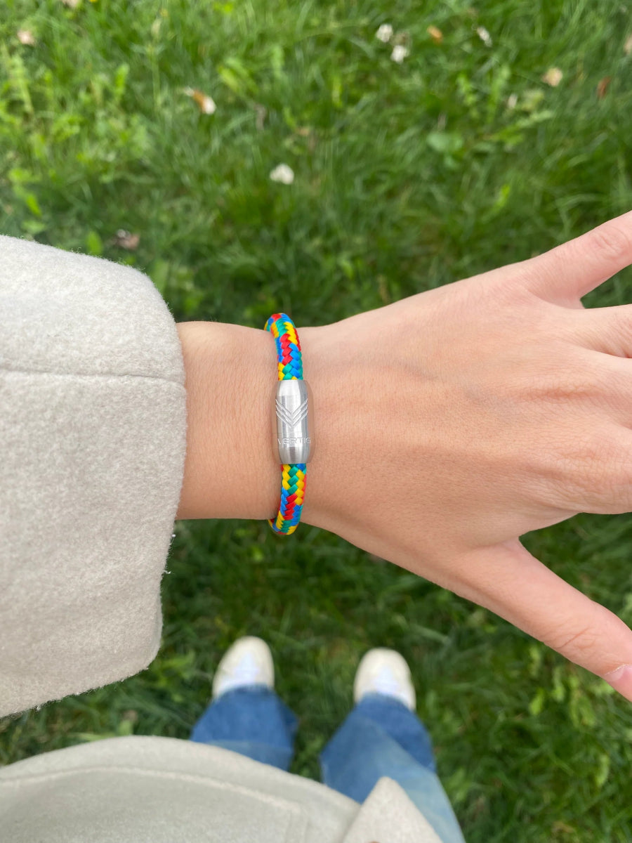 Vertig Magnetic Nautical Paracord Bracelet Multicolor (Slim) on a woman&#39;s wrist. Highlights its slim profile, adding a subtle pop of color.