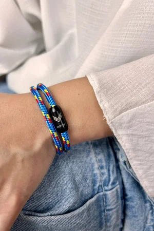 Vertig Magnetic Nautical Paracord Bracelet Multicolor on a woman's wrist. Stylish, durable outdoor accessory.