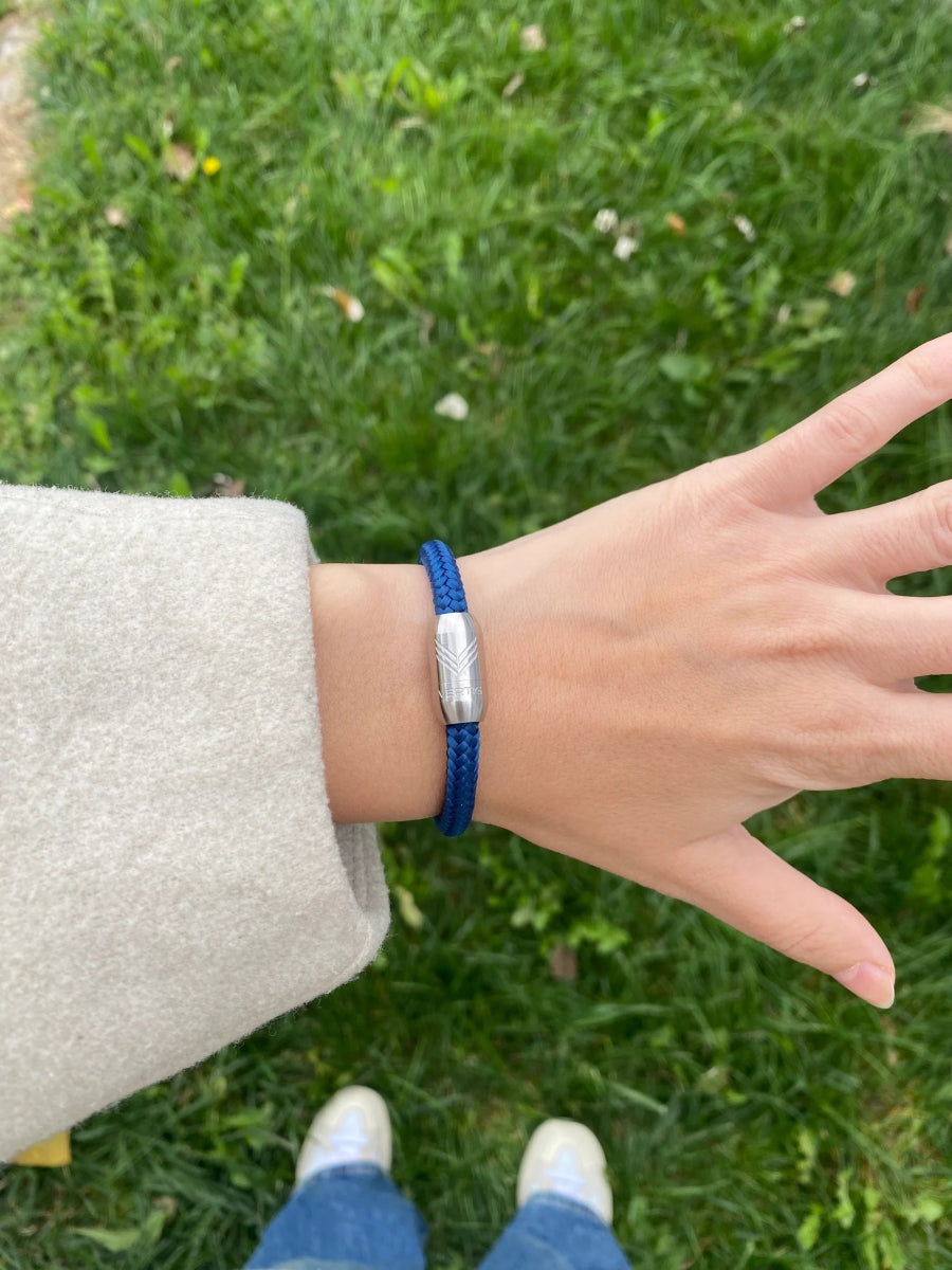 Vertig Magnetic Nautical Paracord Bracelet Navy Blue (Slim) on a woman&#39;s wrist. A stylish accessory for versatile wear.