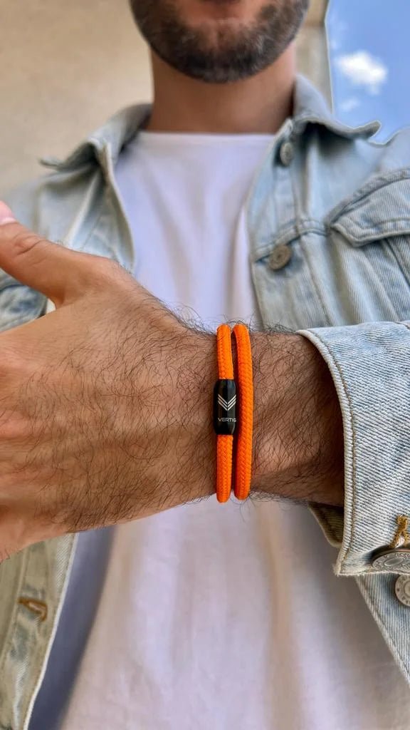 Vertig Magnetic Nautical Paracord Bracelet Orange on a man&#39;s forearm. Durable design, perfect for dynamic lifestyles.