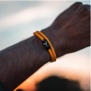 Vertig Magnetic Nautical Paracord Bracelet Orange on a man's wrist. Adds a bold, adventurous statement.