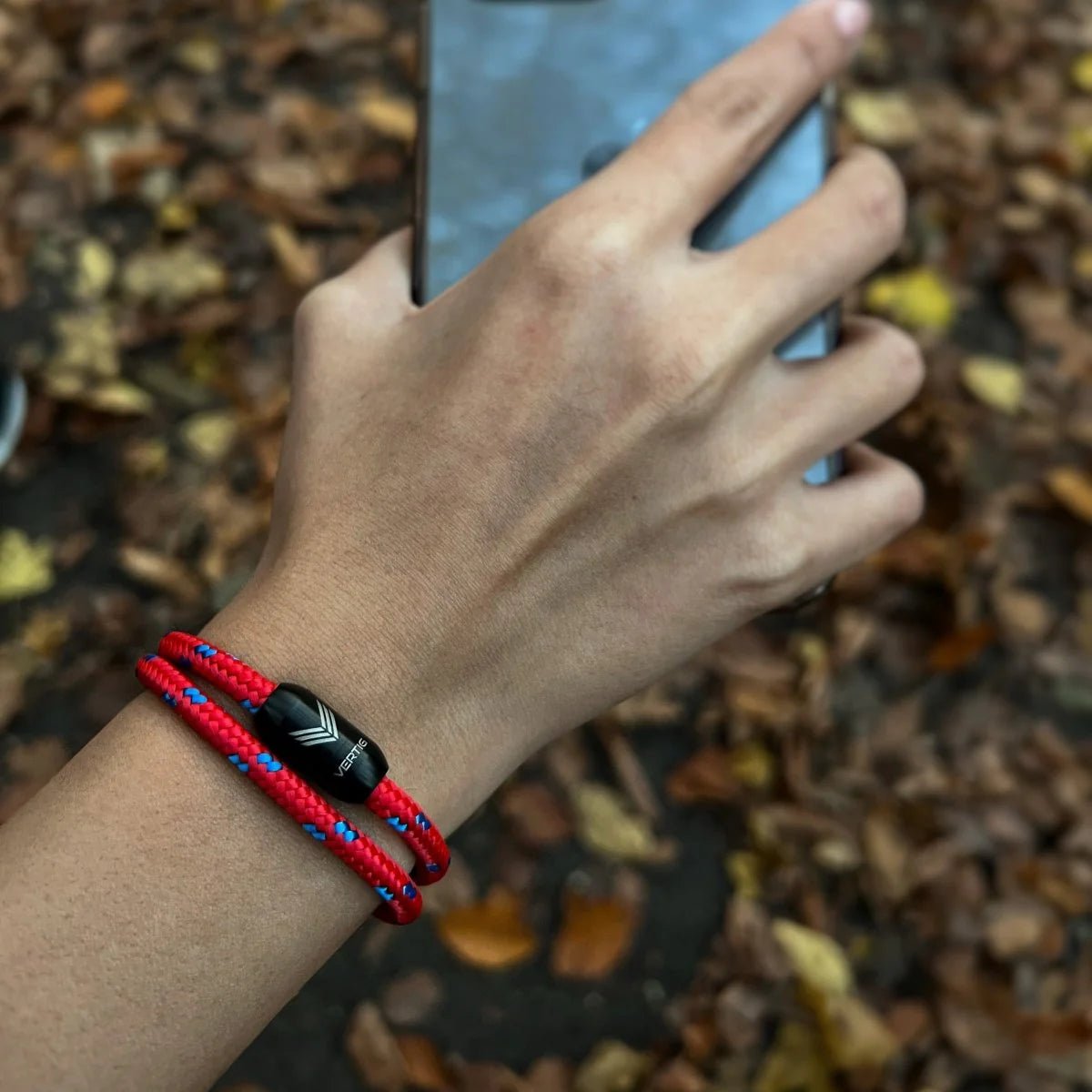 Vertig Magnetic Nautical Paracord Bracelet Red Blue on a woman&#39;s arm. Trendy and comfortable design.