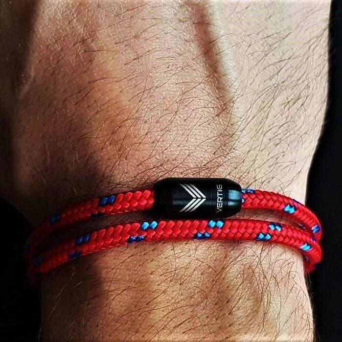 Vertig Magnetic Nautical Paracord Bracelet Red Blue on a man&#39;s forearm. Perfect for casual wear, water-resistant.