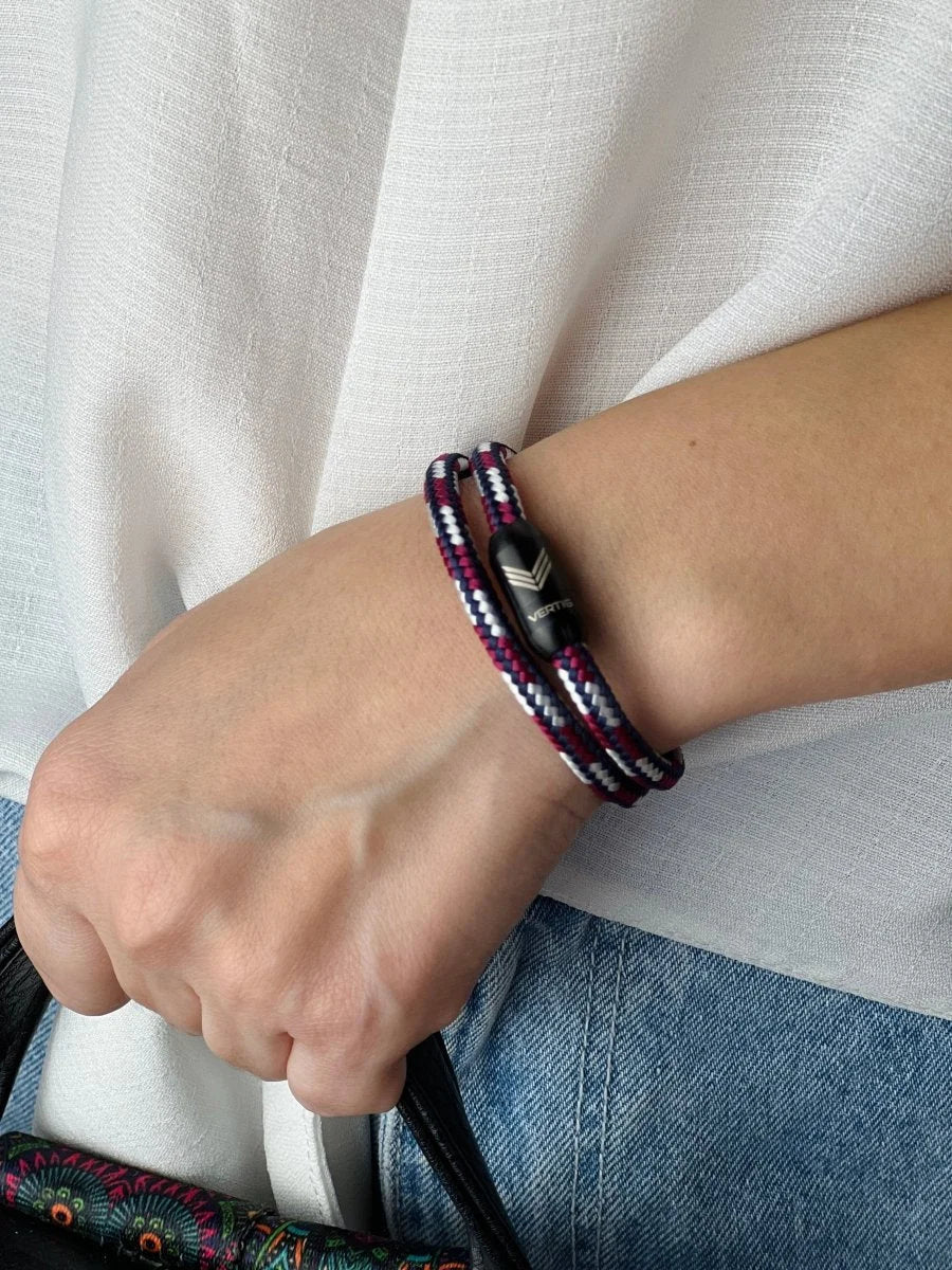 Vertig Magnetic Nautical Paracord Bracelet Red White on a woman&#39;s arm. Comfortable fit, highlighting its distinctive weave.