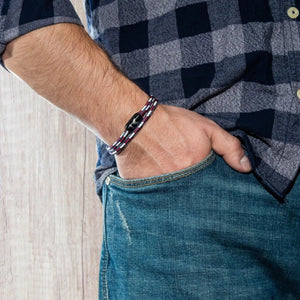 Vertig Magnetic Nautical Paracord Bracelet Red White on a man's forearm. Durable design, perfect for daily adventures.
