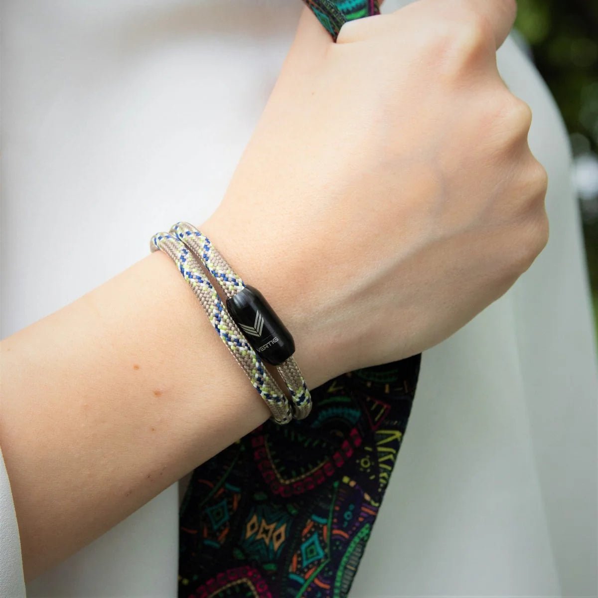 Close-up of Vertig Magnetic Nautical Paracord Bracelet Snake on a woman&#39;s wrist. Unique pattern, secure magnetic clasp.