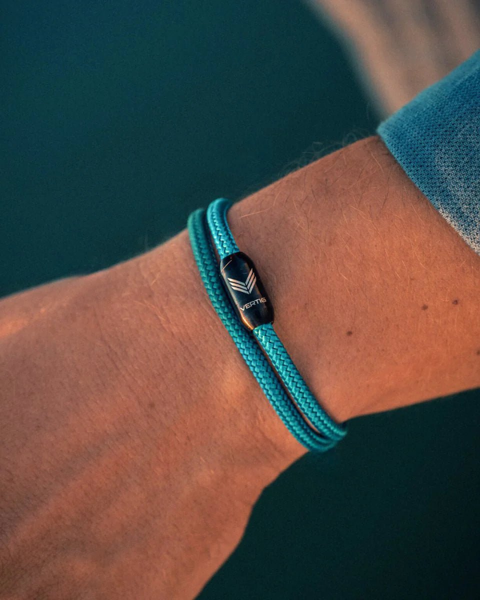 Vertig Magnetic Nautical Paracord Bracelet Turquoise on a man&#39;s forearm. Durable design, perfect for beach or casual wear.
