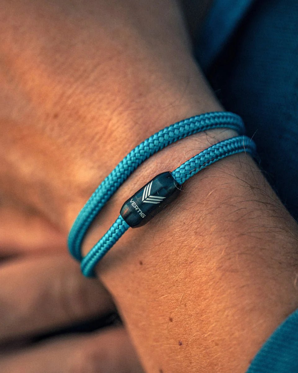 Vertig Magnetic Nautical Paracord Bracelet Turquoise on a man&#39;s wrist. Adds a refreshing, sporty statement.