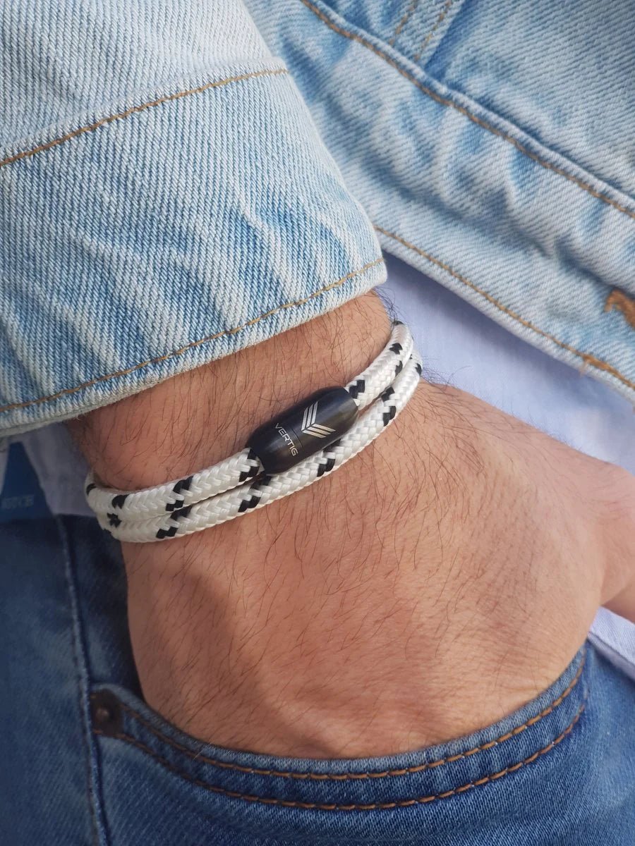 Vertig Magnetic Nautical Paracord Bracelet White Black on a man&#39;s forearm. Durable design, perfect for everyday wear.