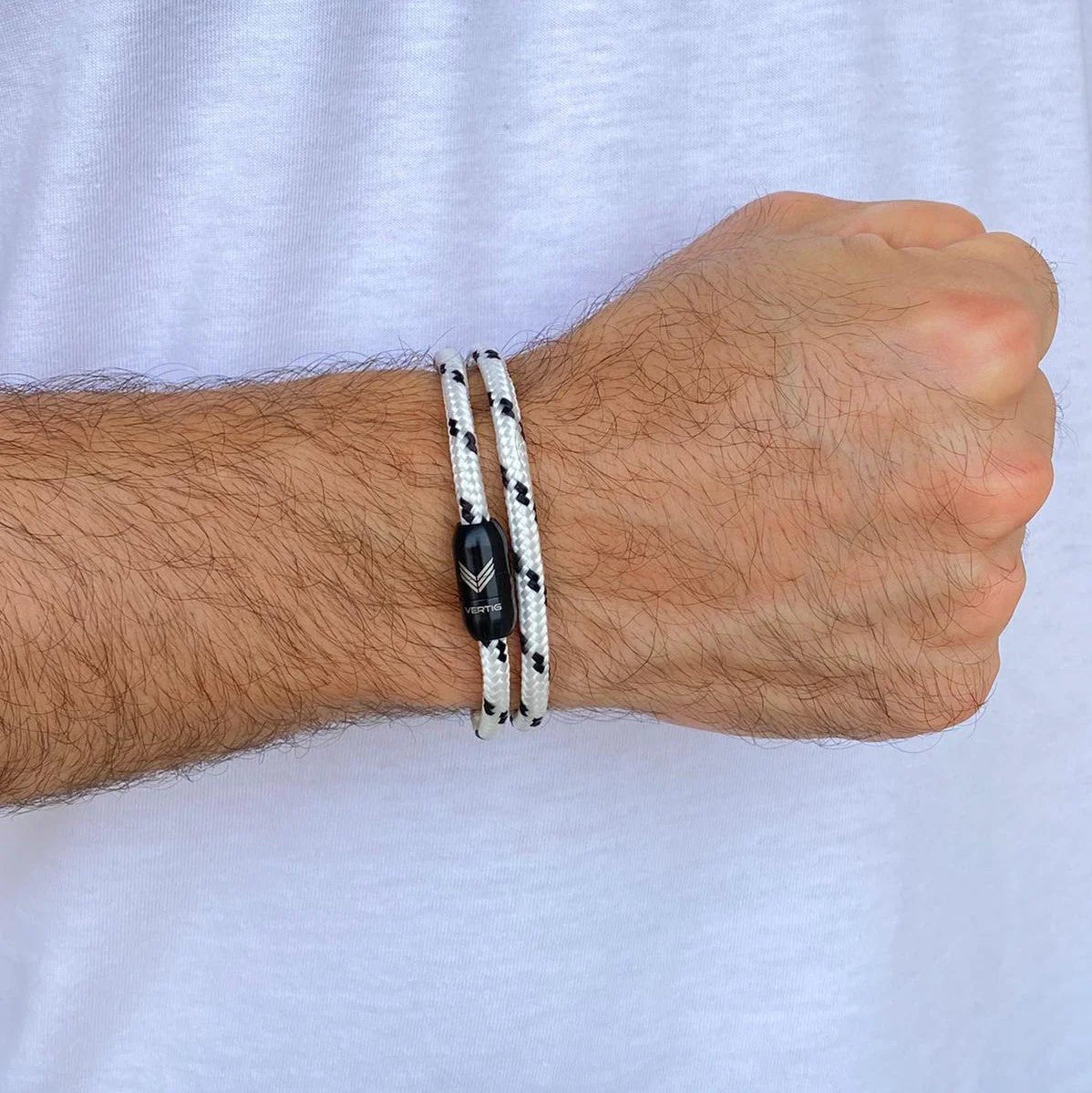 Vertig Magnetic Nautical Paracord Bracelet White Black on a man. A versatile accessory for casual or active pursuits.
