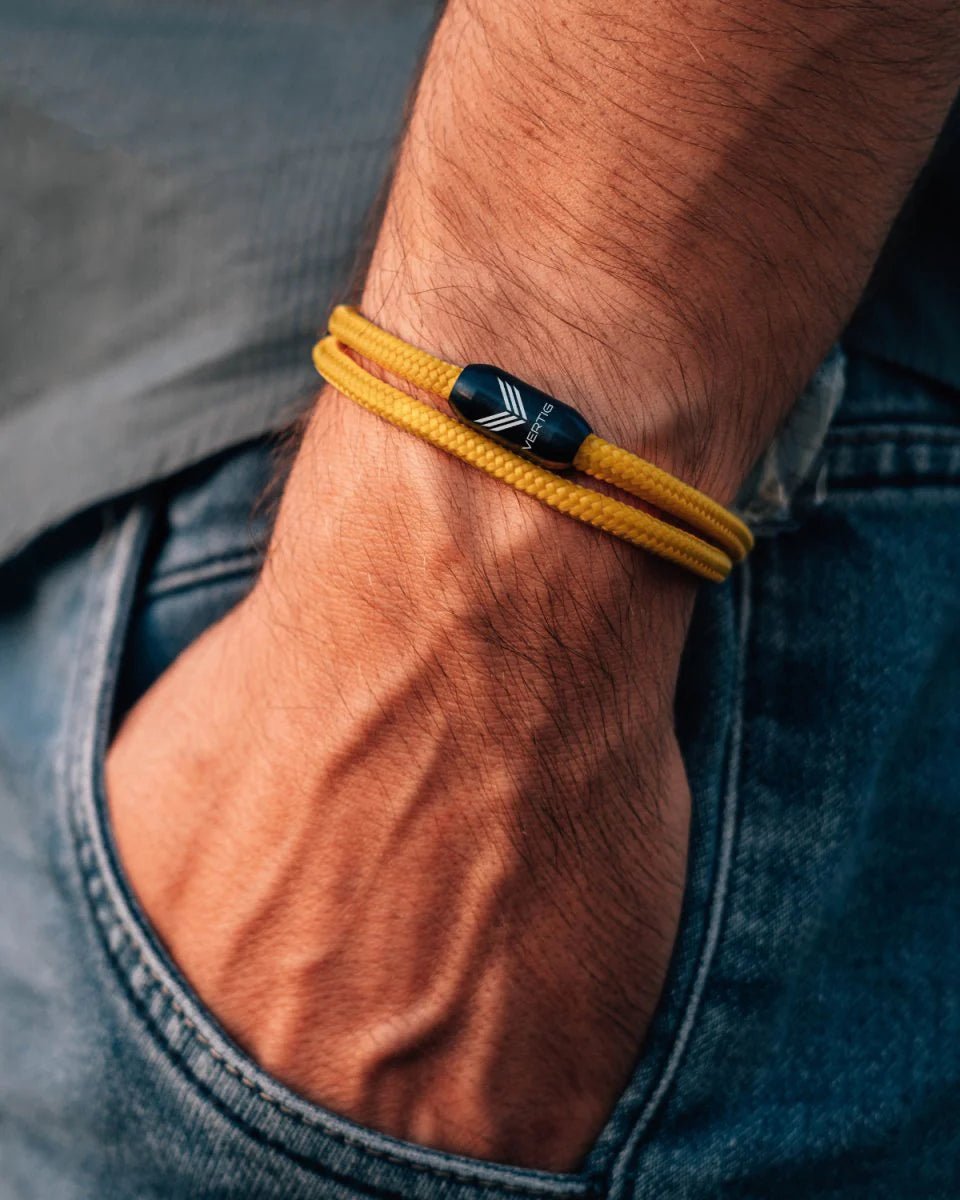 Vertig Magnetic Nautical Paracord Bracelet Yellow on a man&#39;s arm. Sporty, adjustable, ideal for adventure.