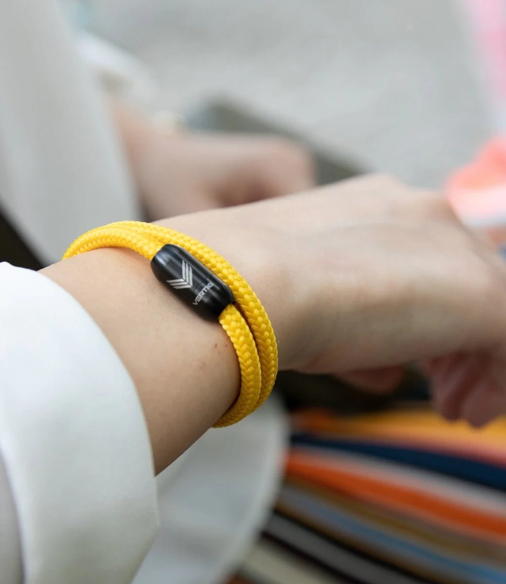 Vertig Magnetic Nautical Paracord Bracelet Yellow on a woman. Perfect for casual wear, durable and water-resistant.