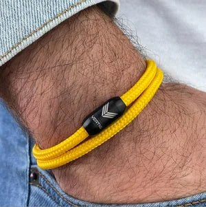 Vertig Magnetic Nautical Paracord Bracelet Yellow on a man's wrist. Lightweight, comfortable, and trendy.
