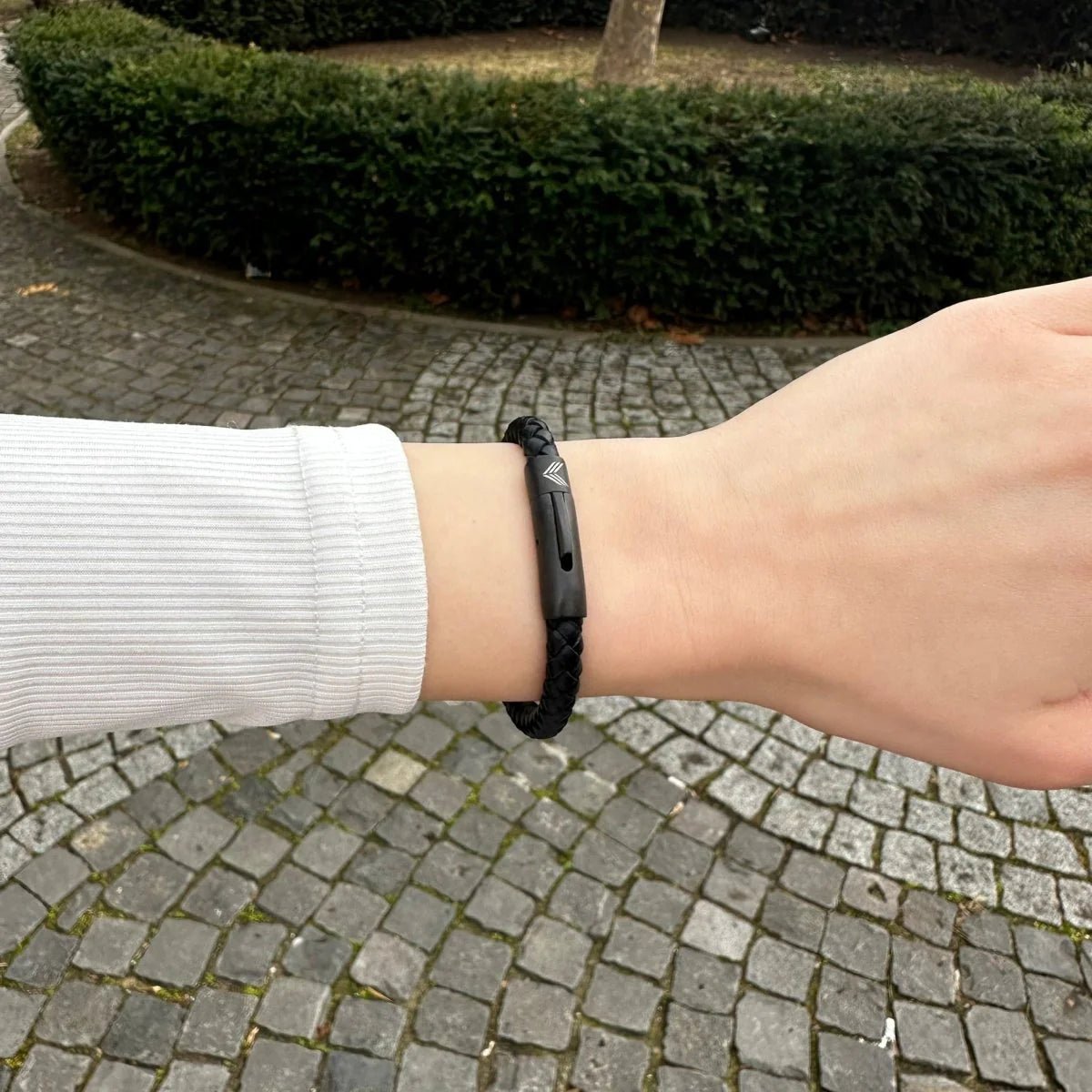 Vertig Leather Bracelet Black on a woman&#39;s arm. Comfortable and effortlessly stylish, reflecting the quality of its premium slim leather.