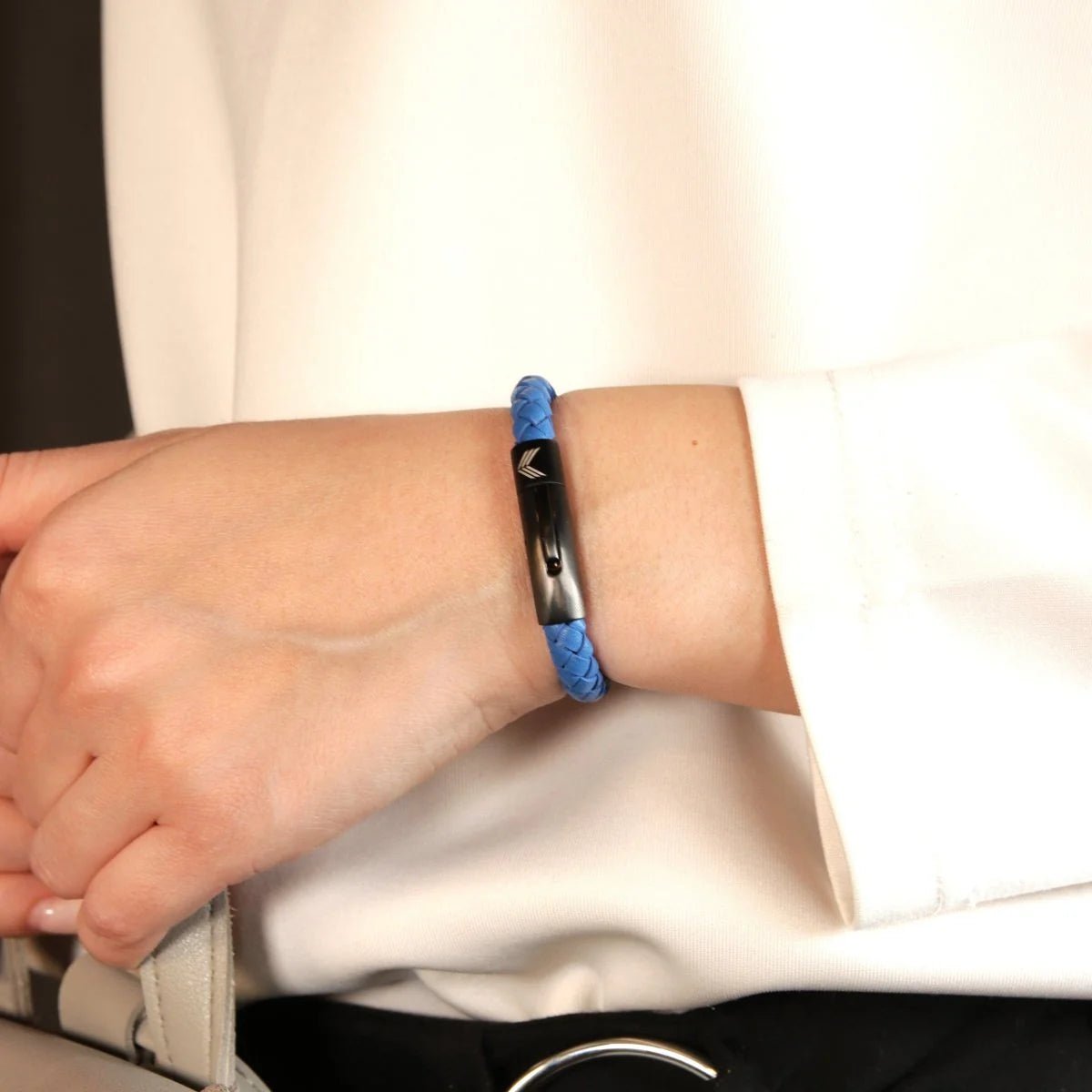 Vertig Leather Bracelet Blue on a woman&#39;s arm. Comfortable and stylish, showcasing the quality of its premium slim leather.