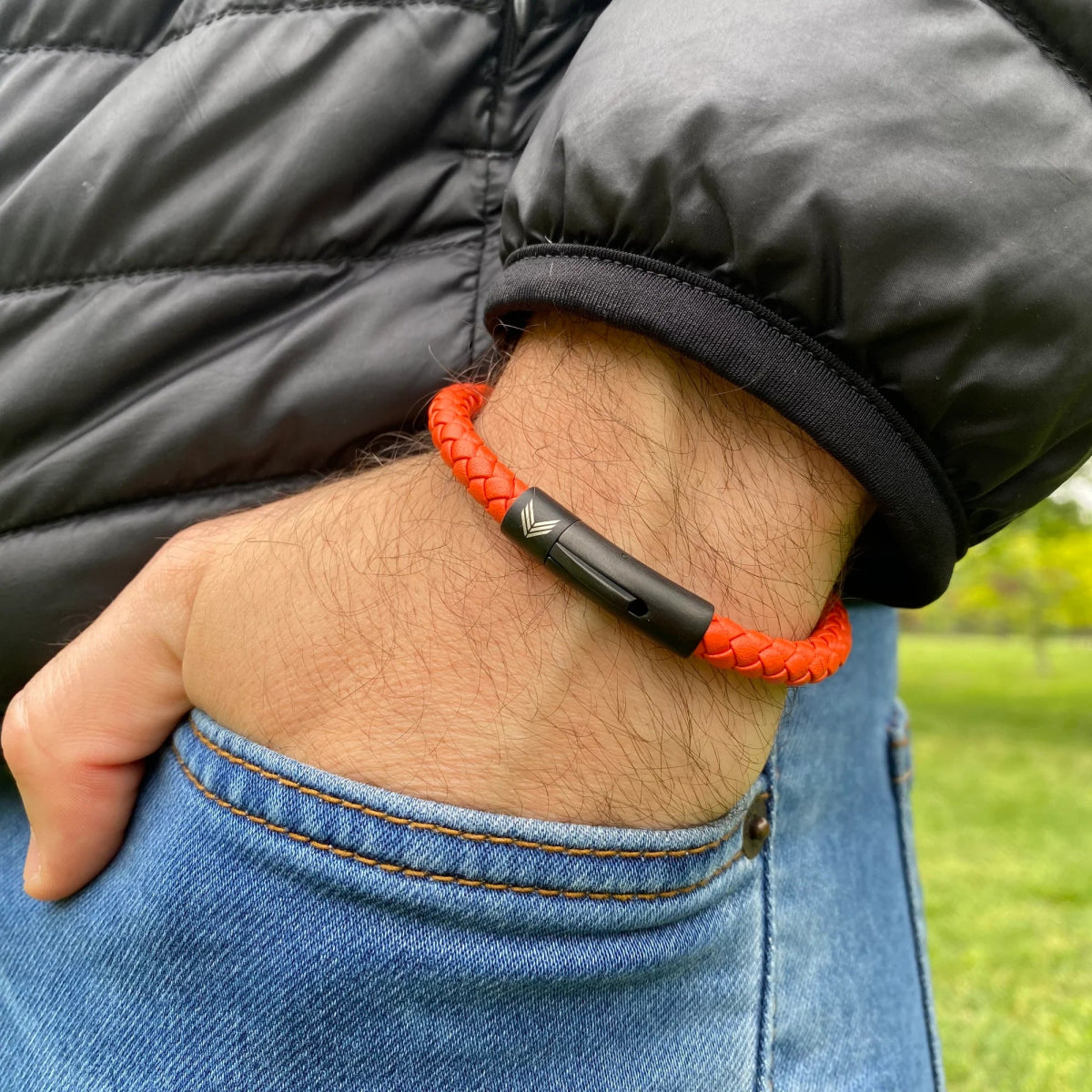 Vertig Leather Bracelet Orange on a man. A versatile accessory, offering eye-catching appeal for any casual look.