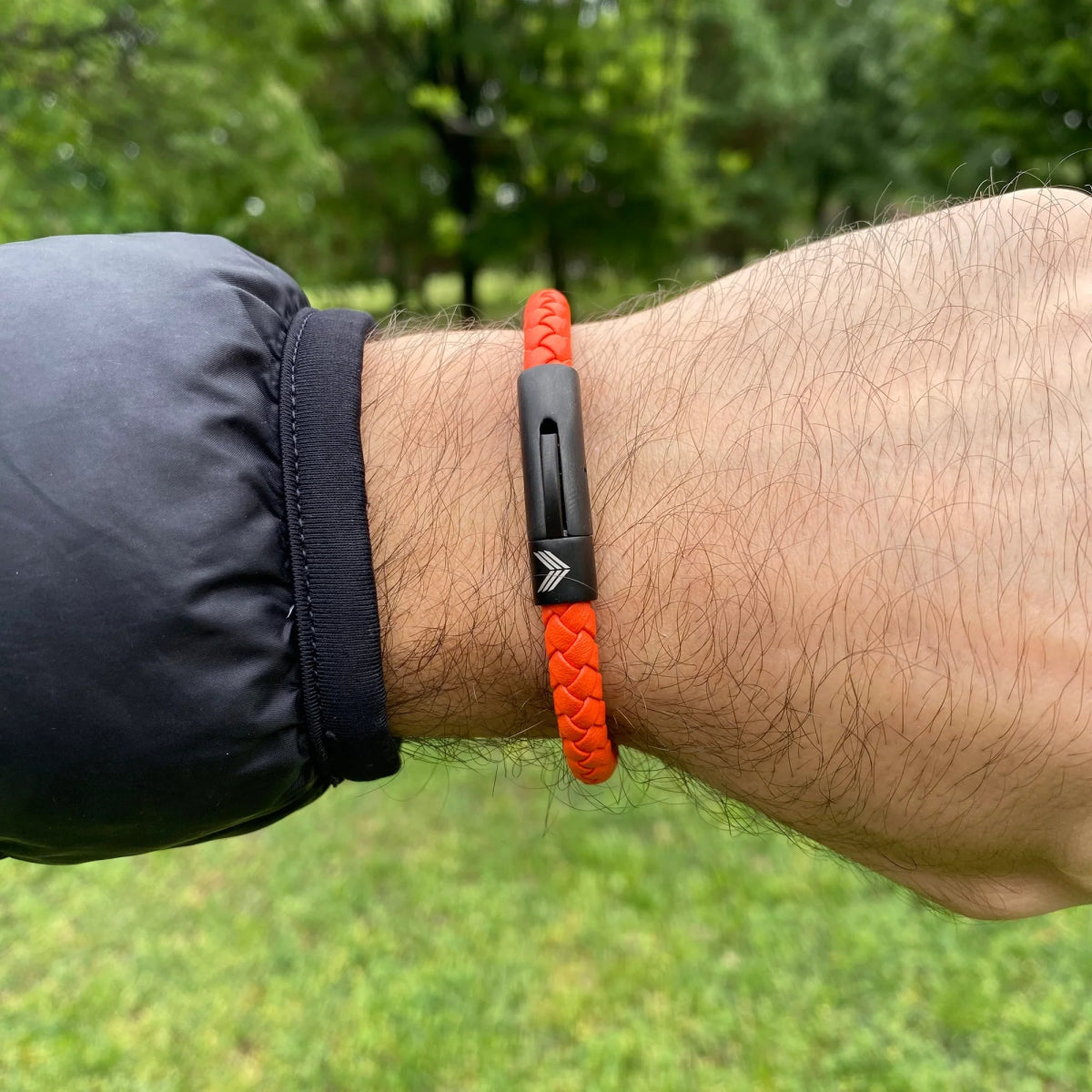 Vertig Leather Bracelet Orange on a man&#39;s forearm. Highlights the supple texture of genuine orange leather, perfect for bold statements.