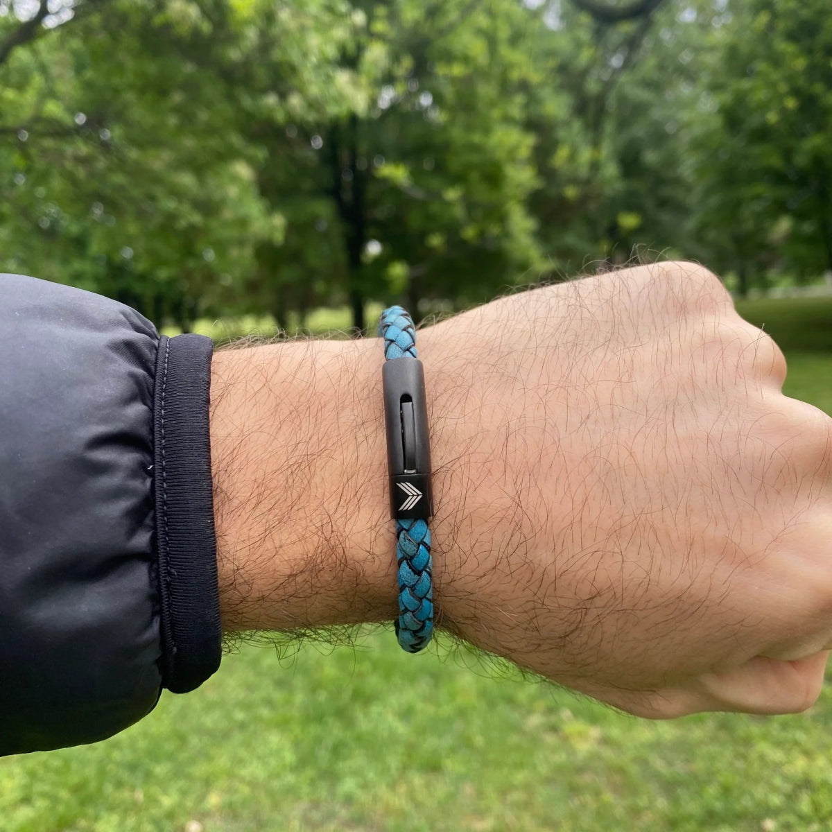 Vertig Leather Bracelet Vintage Blue on a man&#39;s wrist. Accentuates masculine style with its distinctive vintage hue and refined look.