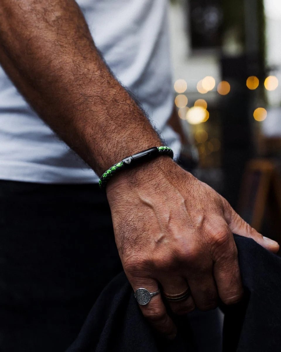 Vertig Leather Bracelet Vintage Green on a man's wrist. Accentuates rugged style with its distinctive vintage hue and secure fit.