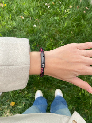 Vertig Leather Bracelet Vintage Red on a woman's wrist. Adds a touch of warm elegance, emphasizing its slender form and rich coloring.