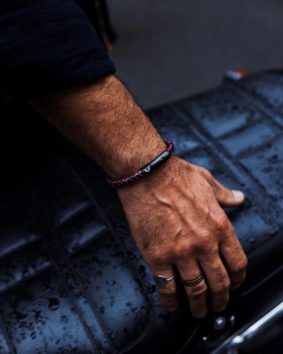 Vertig Leather Bracelet Vintage Red on a man&#39;s wrist. Accentuates rugged charm with its distinct vintage hue and secure fit for daily wear.