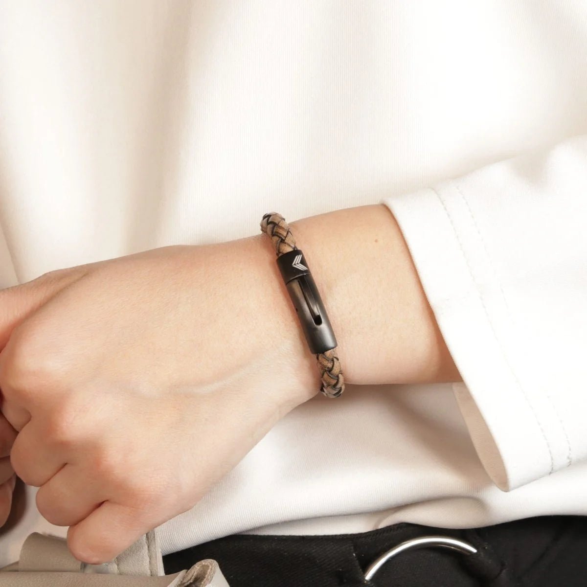 Vertig Leather Bracelet Vintage White on a woman&#39;s arm. Comfortable and effortlessly stylish, reflecting the quality of its premium slim leather.