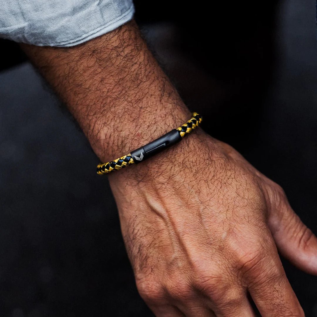 Vertig Leather Bracelet Vintage Yellow on a man&#39;s wrist. Accentuates rugged charm with its distinct vintage hue and secure fit.